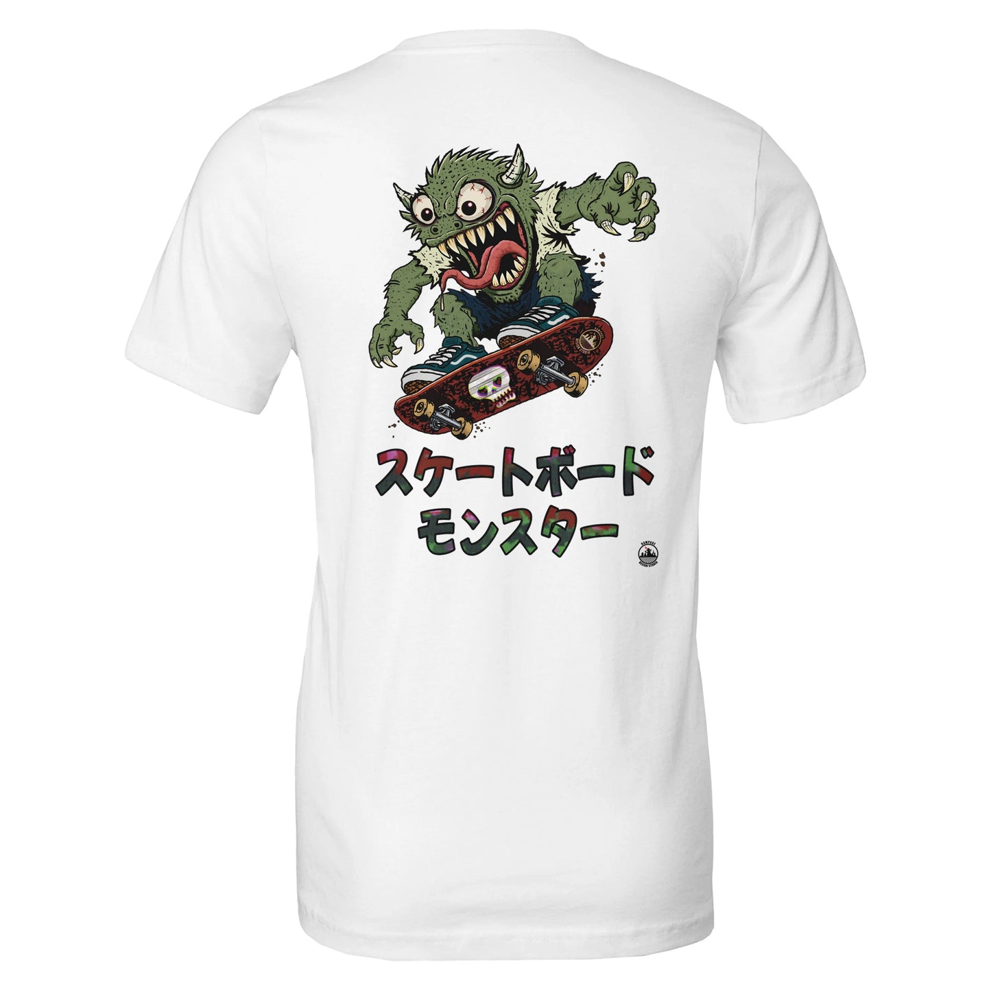 White short-sleeve t-shirt showing the back with a large graphic of a green cartoon monster riding a skateboard, with Japanese text underneath.